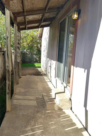 a view of a porch with wooden floor and outer view