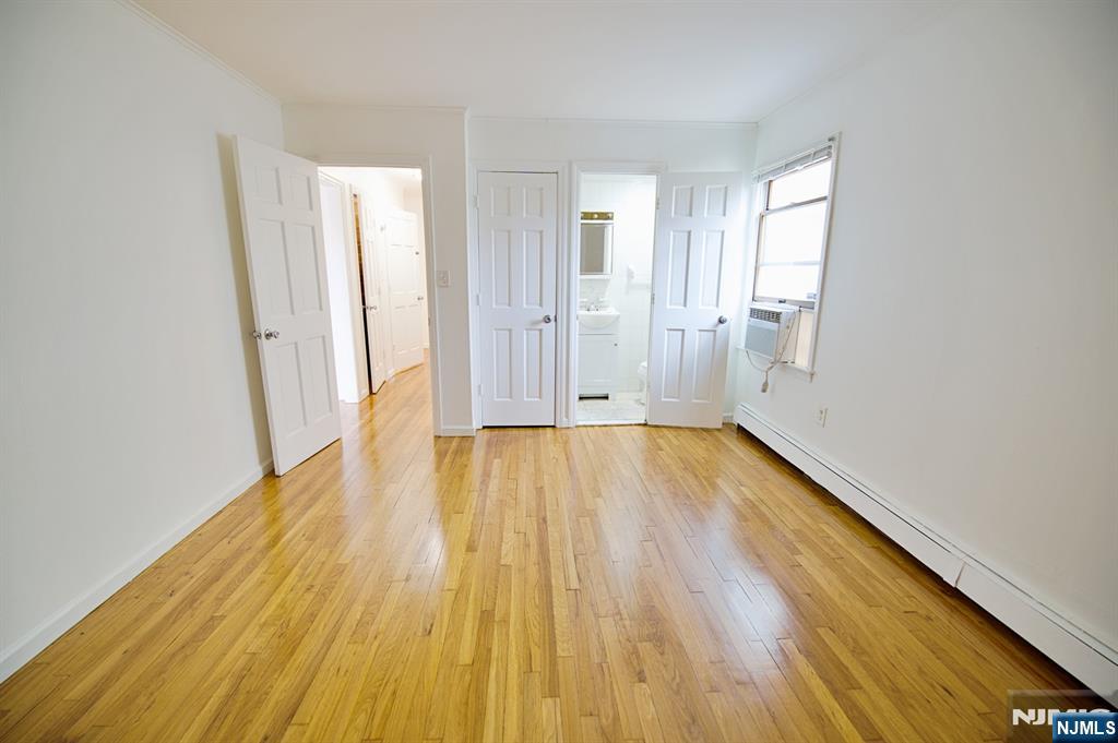 1160 River Road, Unit 1 Edgewater, NJ 07020 - Photo 14 of 18 a view of a room with wooden floor and bathroom