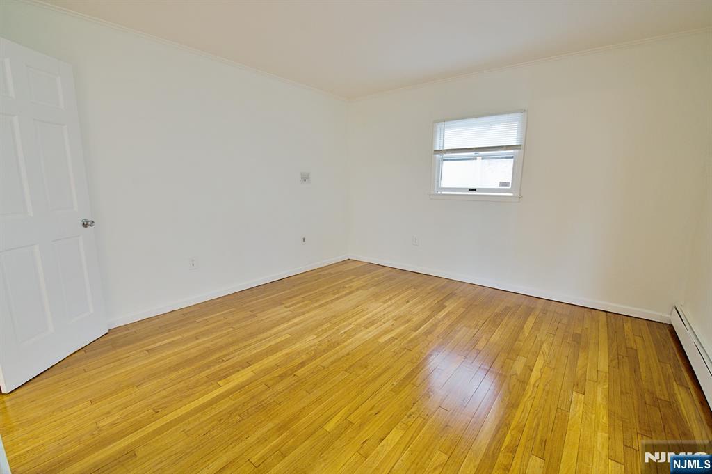 1160 River Road, Unit 1 Edgewater, NJ 07020 - Photo 16 of 18 a view of empty room with wooden floor