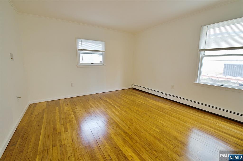 1160 River Road, Unit 1 Edgewater, NJ 07020 - Photo 17 of 18 a view of a room with wooden floor and window