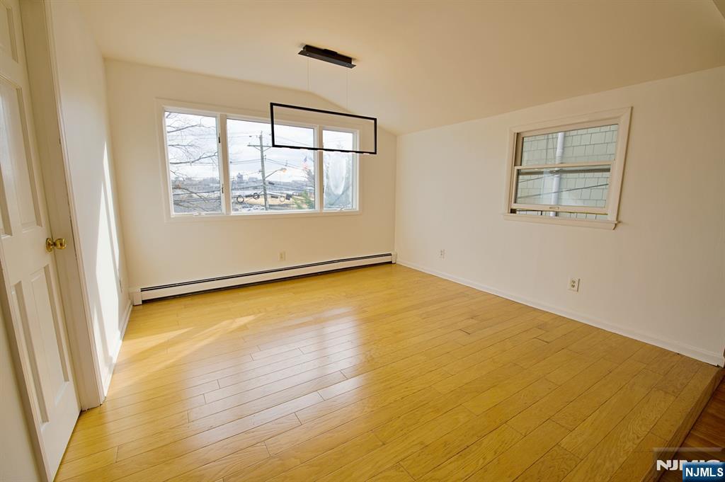 1160 River Road, Unit 1 Edgewater, NJ 07020 - Photo 4 of 18 a view of an empty room with a window