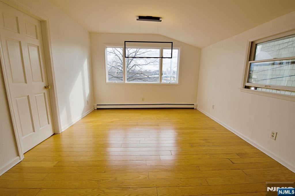 1160 River Road, Unit 1 Edgewater, NJ 07020 - Photo 5 of 18 a view of a room with wooden floor and window