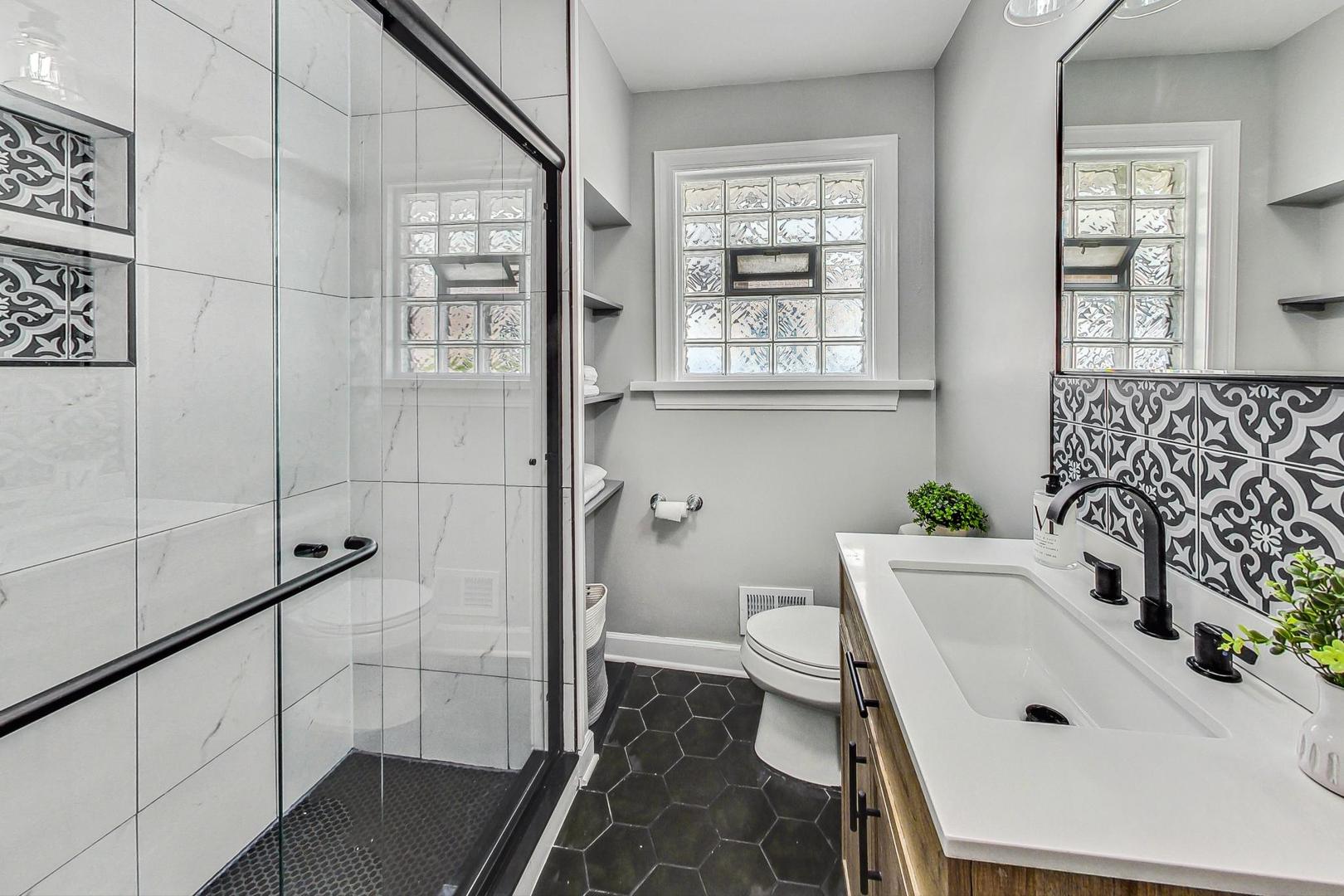 467 Ida Lane Elmhurst, IL 60126 - Photo 12 of 18 a bathroom with a sink and a toilet