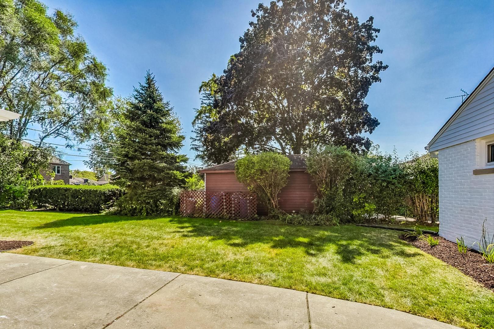 467 Ida Lane Elmhurst, IL 60126 - Photo 15 of 18 a view of a backyard with large trees