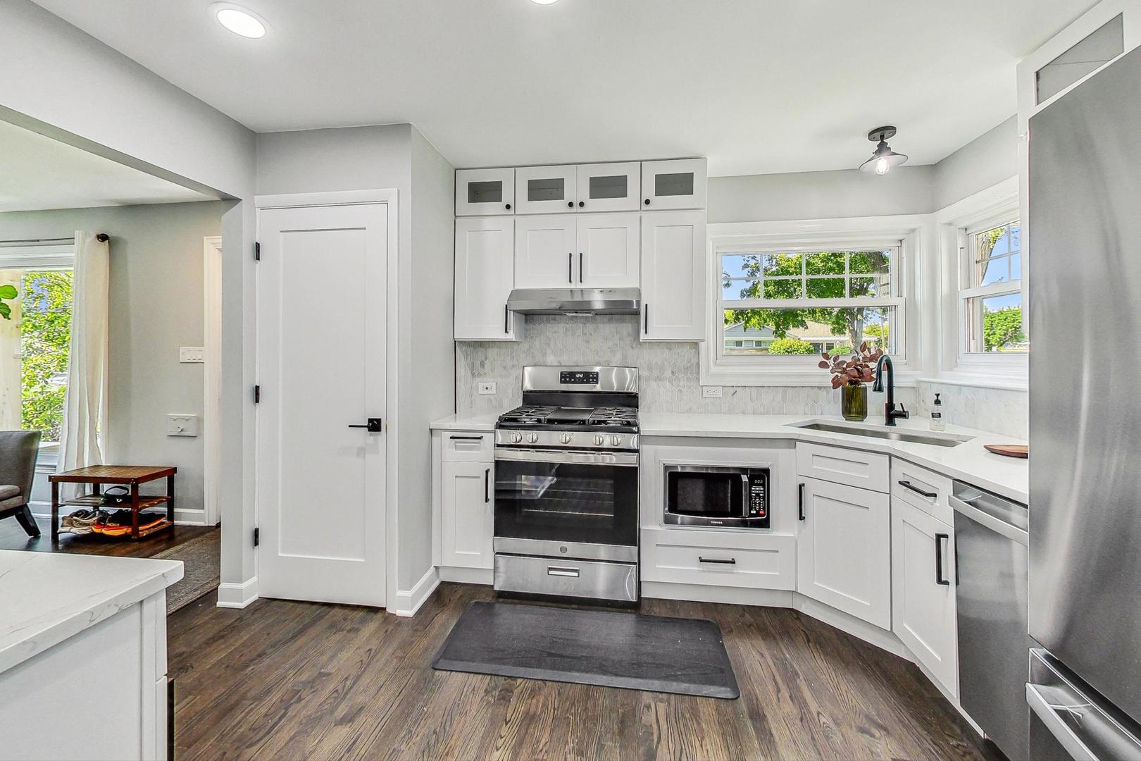 467 Ida Lane Elmhurst, IL 60126 - Photo 6 of 18 a kitchen with a stove a sink and a window