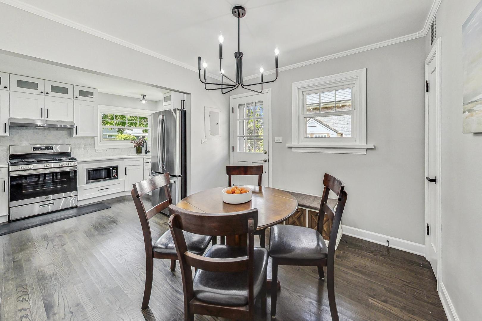 467 Ida Lane Elmhurst, IL 60126 - Photo 7 of 18 a view of a dining room with furniture window and wooden floor