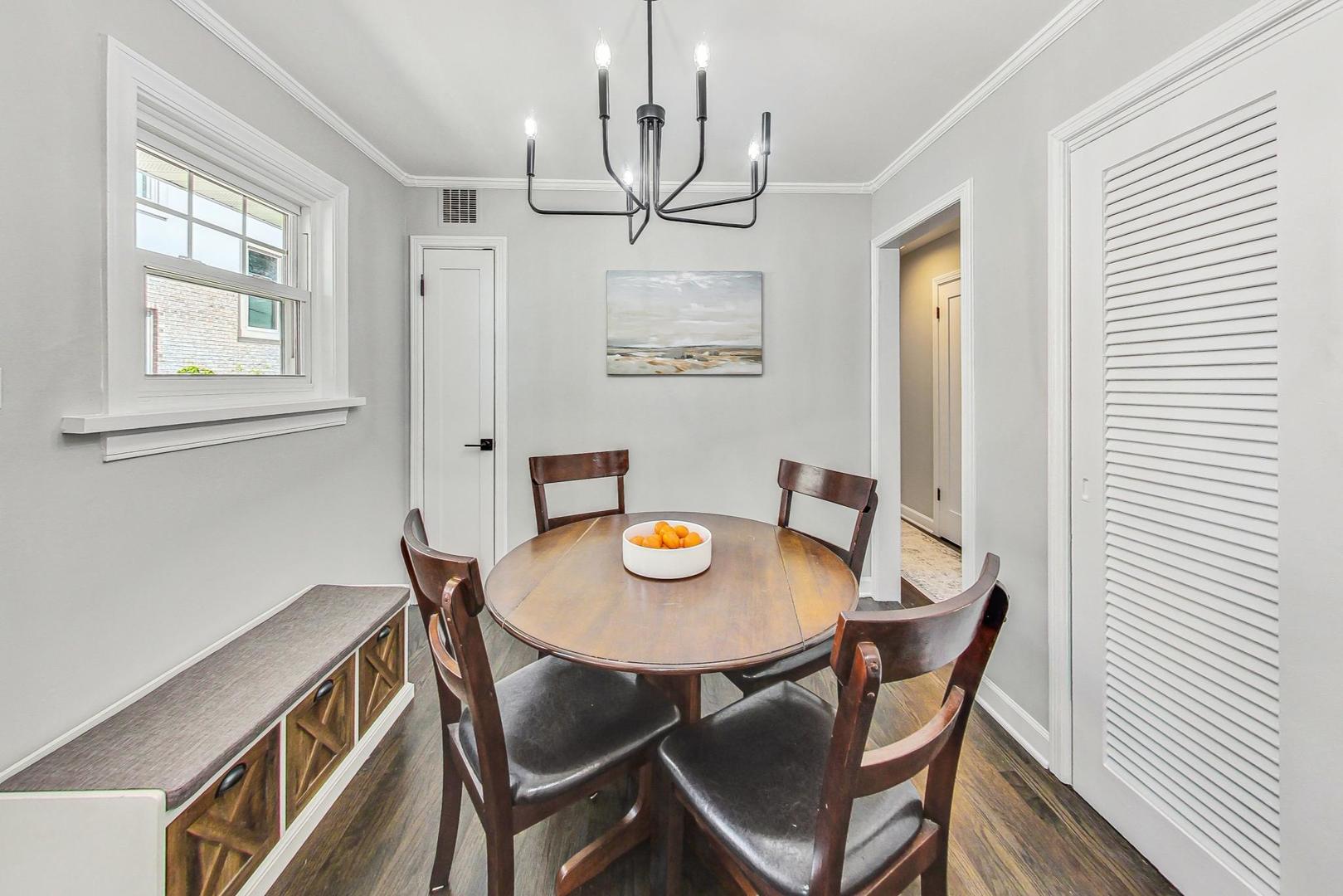 467 Ida Lane Elmhurst, IL 60126 - Photo 8 of 18 a view of a dining room with furniture and a chandelier