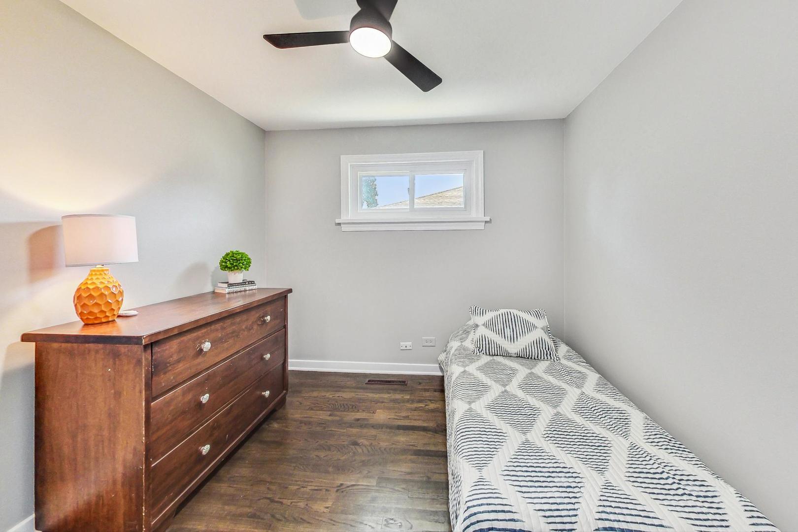 467 Ida Lane Elmhurst, IL 60126 - Photo 10 of 18 a room with a dresser and window