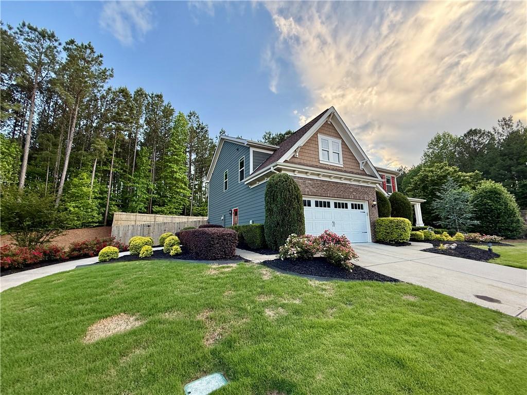 22 Watervine Court Dallas, GA 30132 - Photo 13 of 90 a front view of a house with a garden and yard