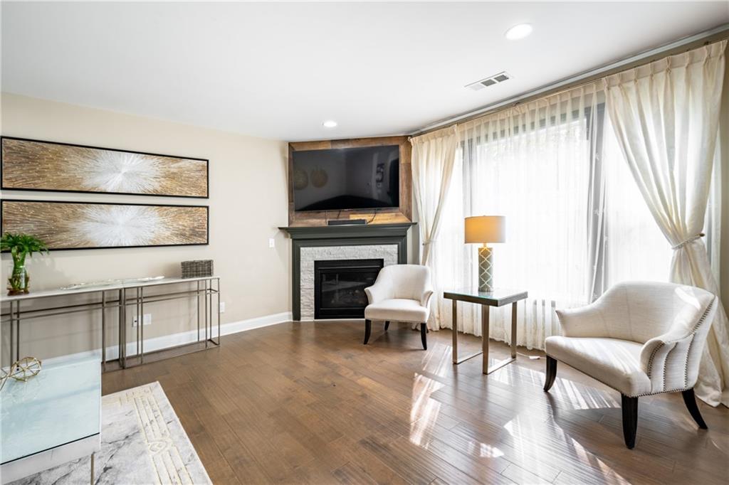 22 Watervine Court Dallas, GA 30132 - Photo 33 of 90 a living room with furniture a flat screen tv and a fireplace