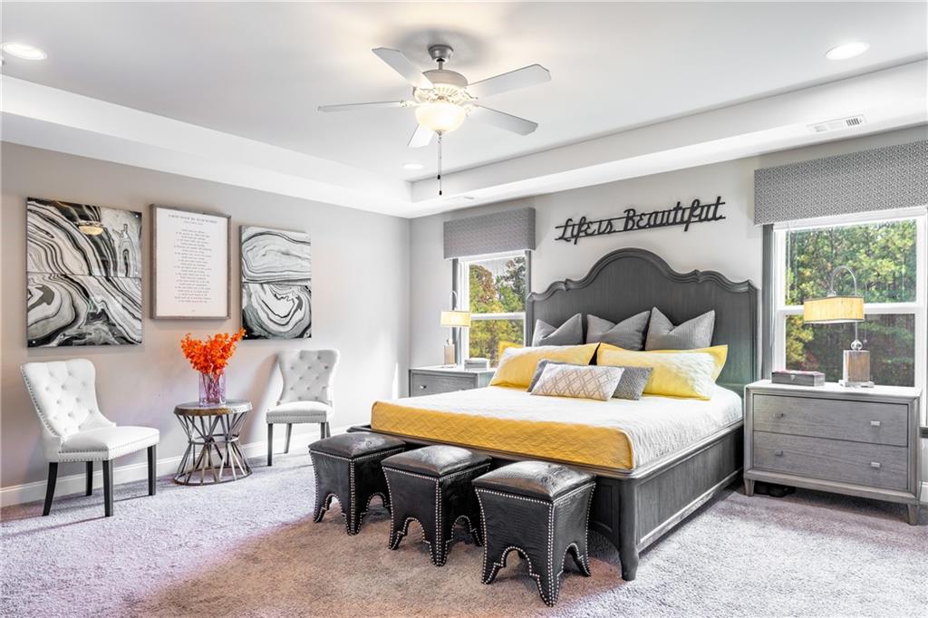 22 Watervine Court Dallas, GA 30132 - Photo 47 of 90 a bedroom with a bed a table and painting on the wall