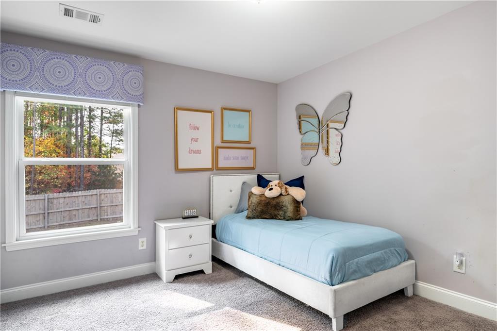 22 Watervine Court Dallas, GA 30132 - Photo 57 of 90 a bedroom with a bed and a window