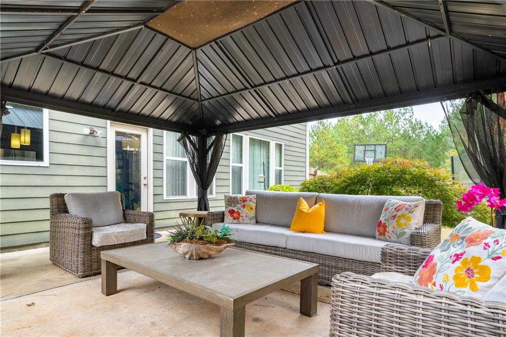 22 Watervine Court Dallas, GA 30132 - Photo 69 of 90 a outdoor living space with furniture and garden view