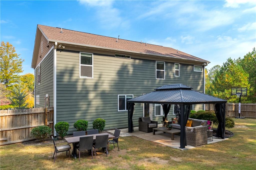 22 Watervine Court Dallas, GA 30132 - Photo 88 of 90 a backyard of a house with seating space