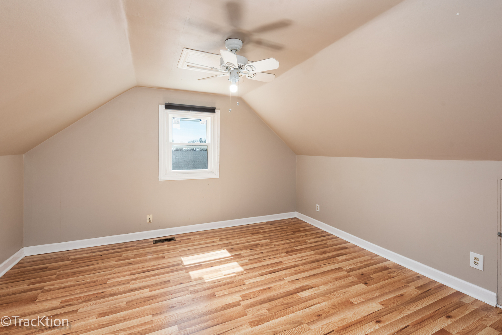 8829 Skyline Drive Burr Ridge, IL 60527 - Photo 18 of 32 a view of a room with wooden floor and fan