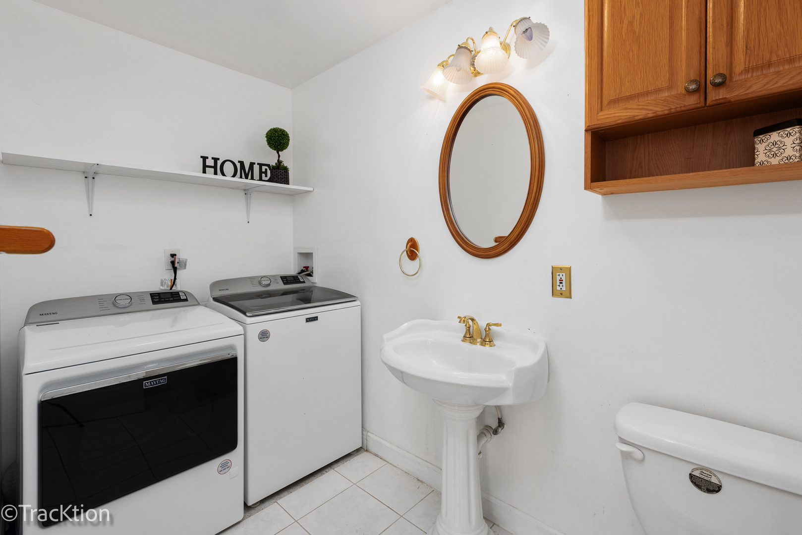 8829 Skyline Drive Burr Ridge, IL 60527 - Photo 19 of 32 a utility room with sink dryer and washer