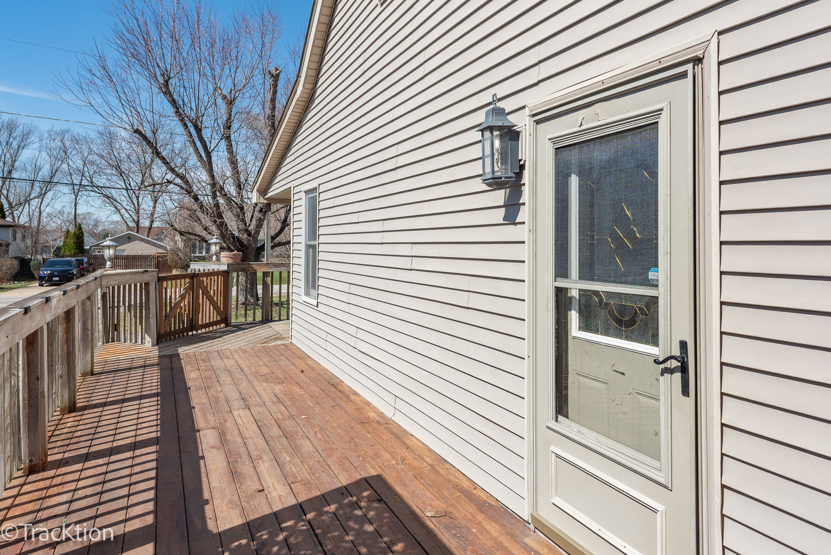 8829 Skyline Drive Burr Ridge, IL 60527 - Photo 2 of 32 a view of a balcony with wooden floor and fence and a window