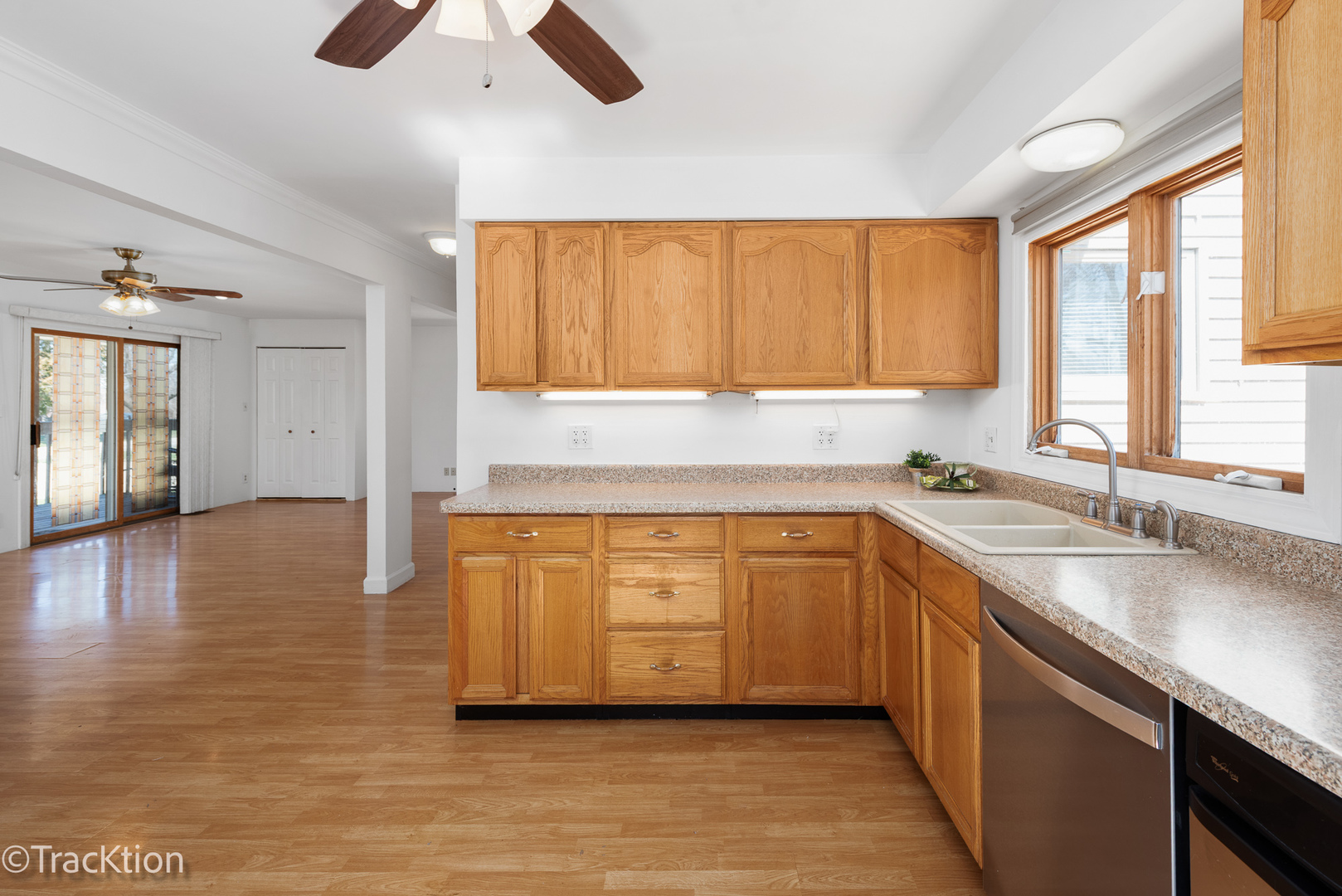 8829 Skyline Drive Burr Ridge, IL 60527 - Photo 4 of 32 a kitchen with stainless steel appliances granite countertop a sink a stove and cabinets