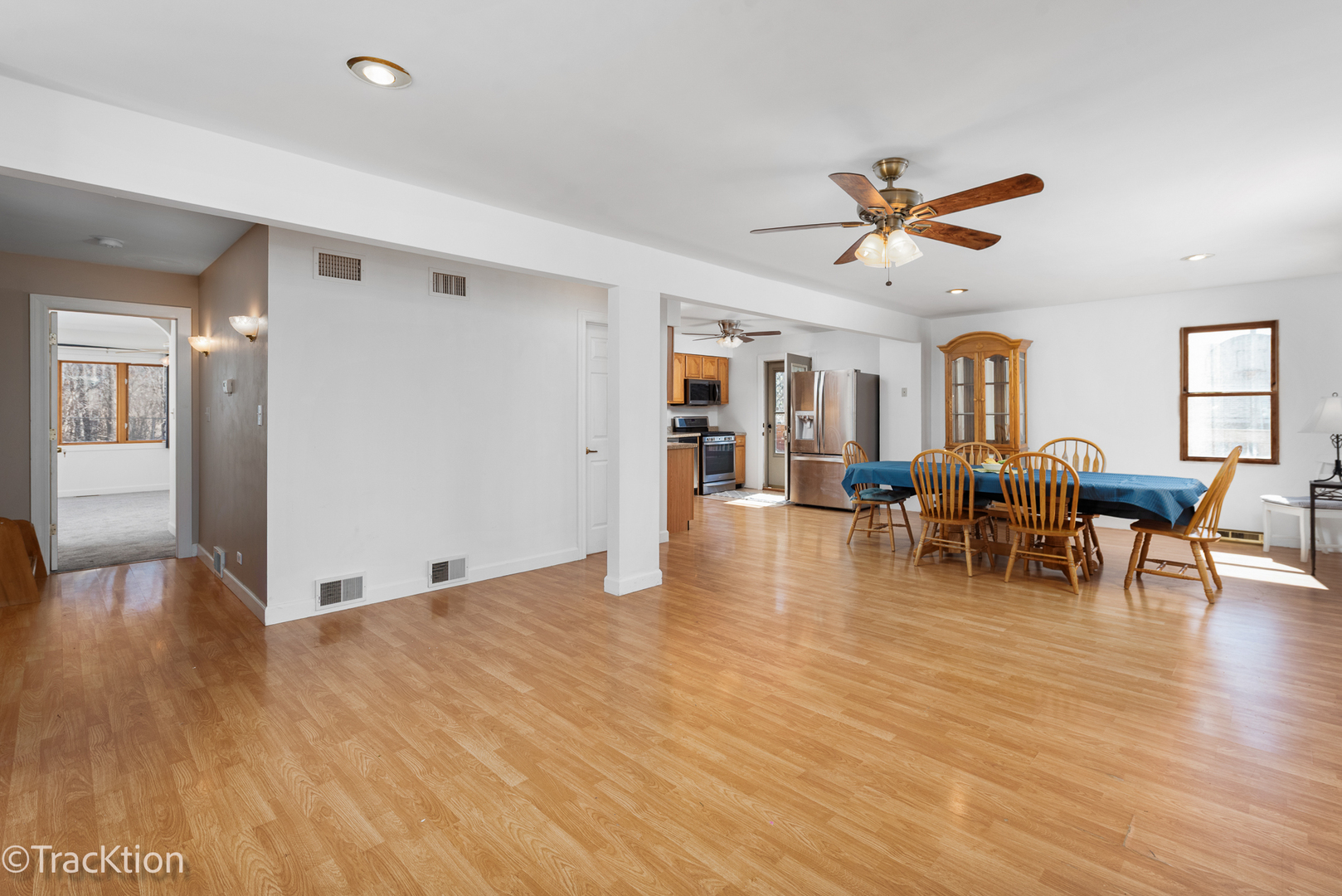 8829 Skyline Drive Burr Ridge, IL 60527 - Photo 7 of 32 a view of a livingroom with furniture and a table wooden floor