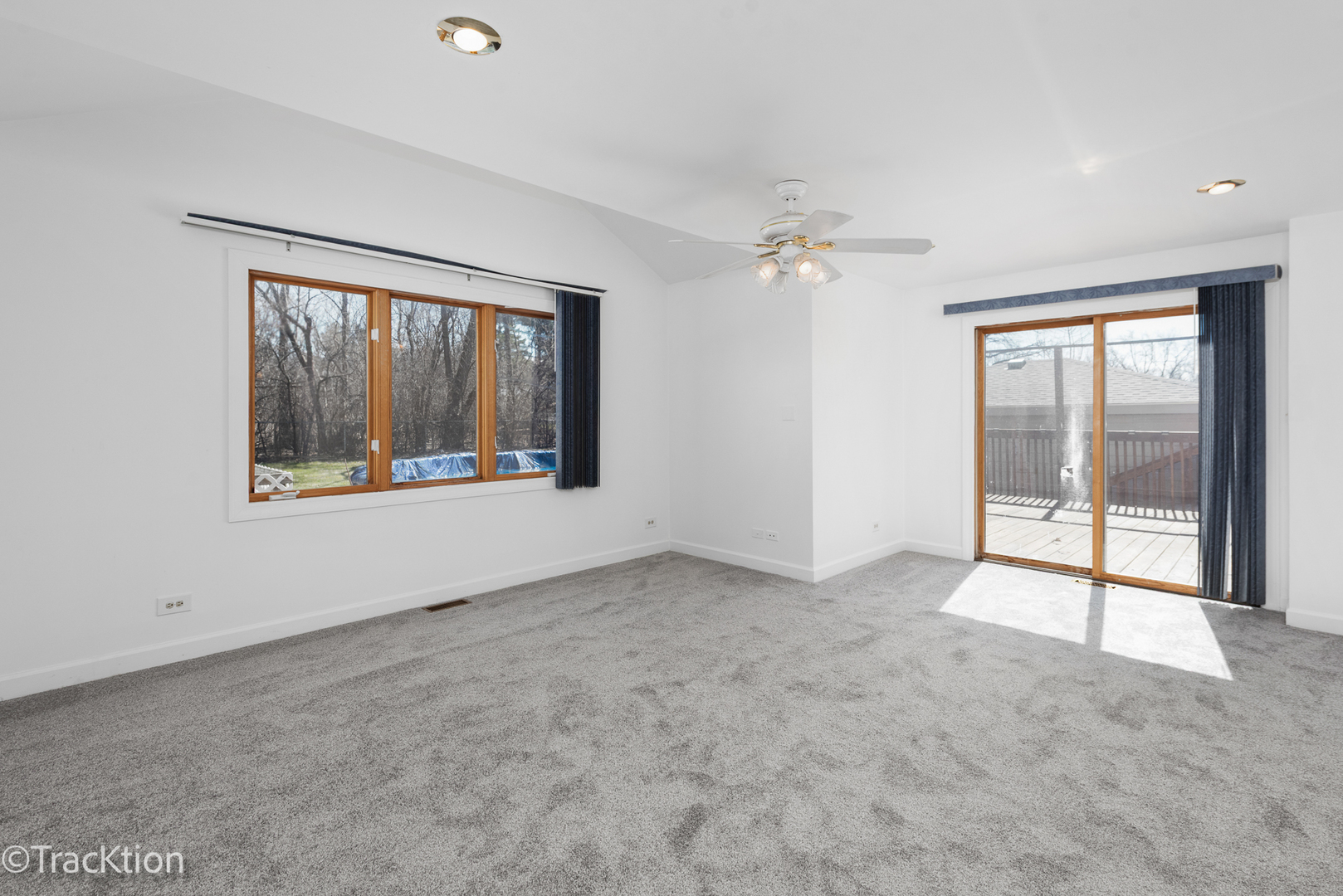 8829 Skyline Drive Burr Ridge, IL 60527 - Photo 9 of 32 an empty room with chandelier fan and windows