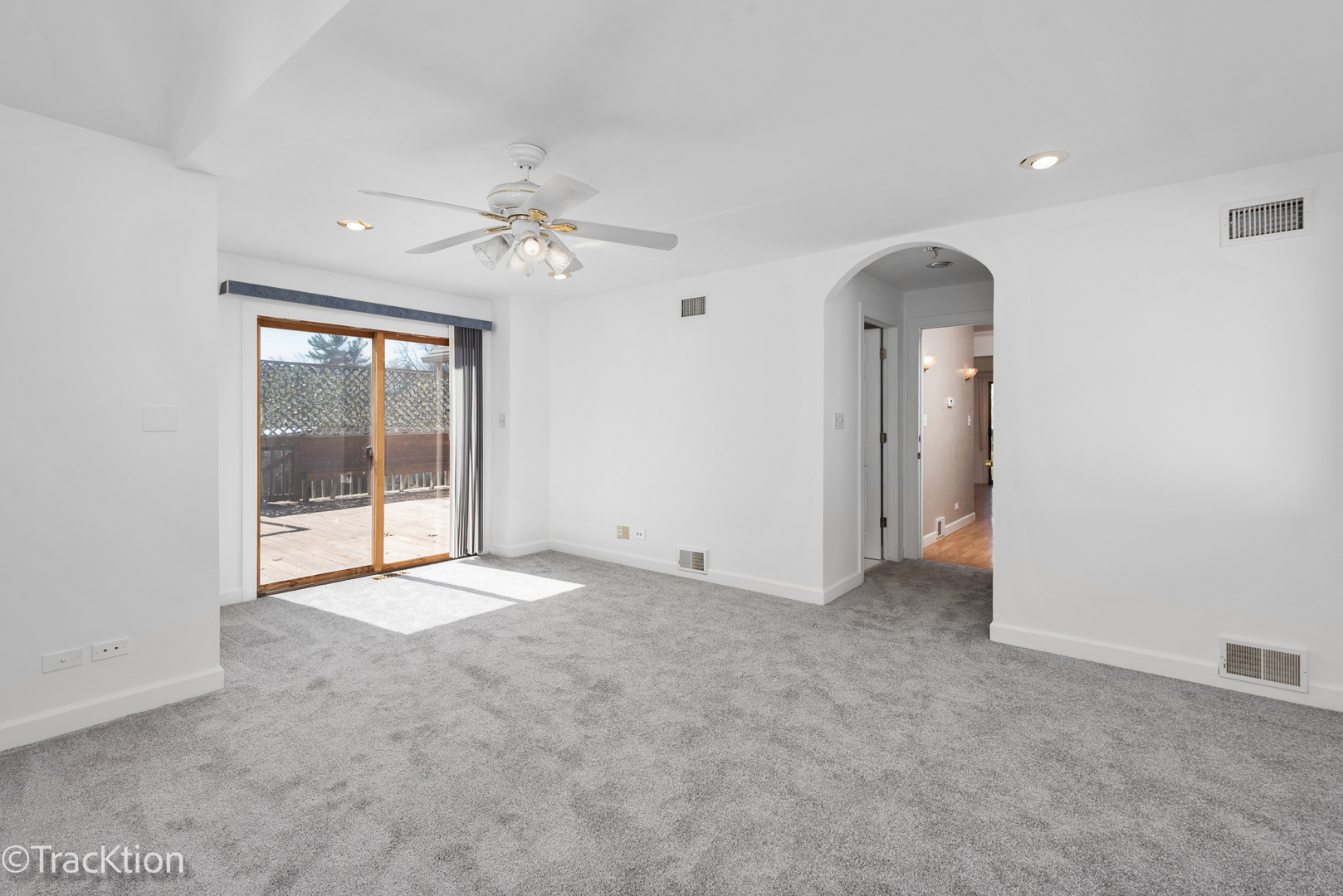 8829 Skyline Drive Burr Ridge, IL 60527 - Photo 10 of 32 an empty room with chandelier fan and windows