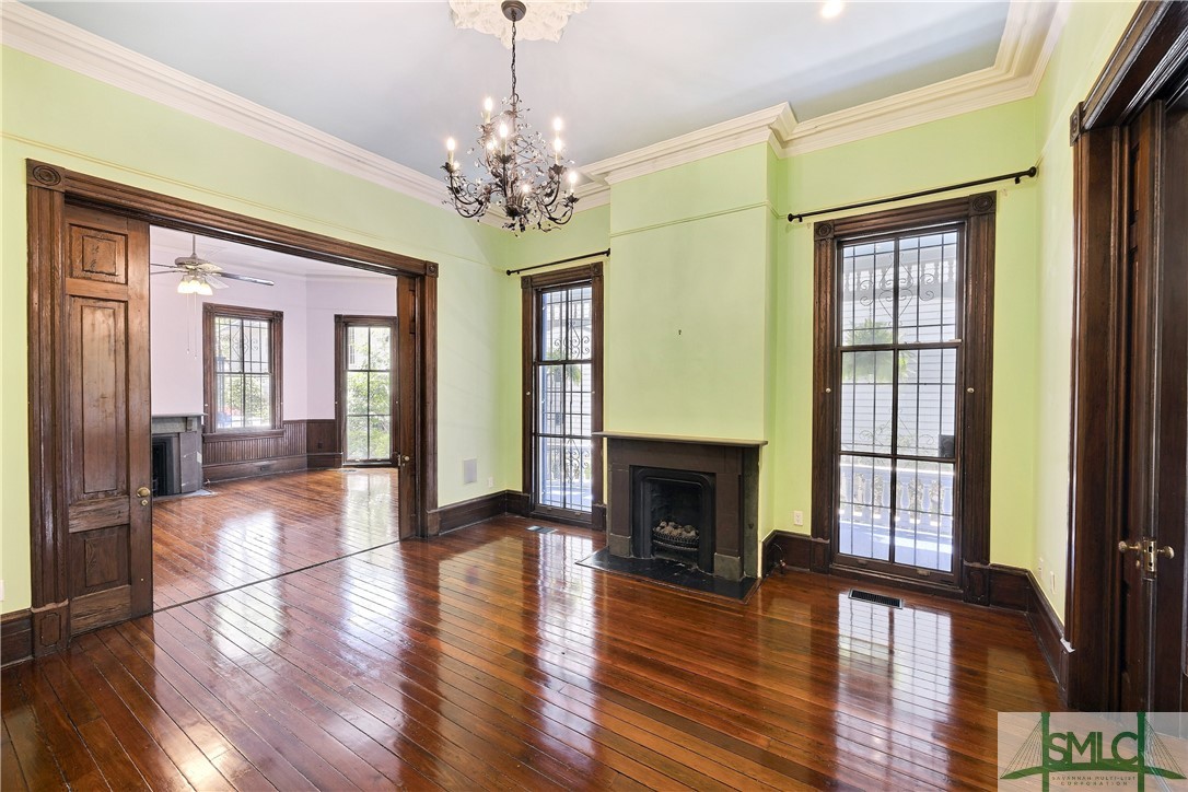612 Barnard Street Savannah, GA 31401 - Photo 14 of 50 Middle room of three large rooms on the first floor perfect for entertaining. Large pocket doors can be opened or closed to provide the perfect size space.