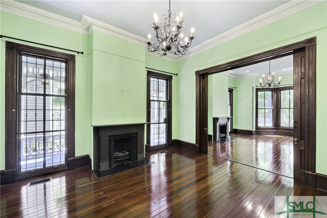 612 Barnard Street Savannah, GA 31401 - Photo 16 of 50 Middle room view of side porch. The side porch can be accessed through these large windows.
