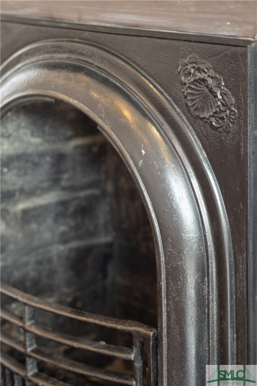 612 Barnard Street Savannah, GA 31401 - Photo 34 of 50 Intricate detailing on a fireplace