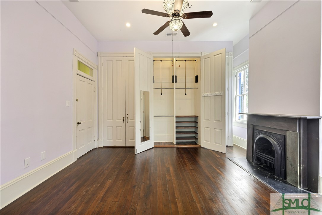 612 Barnard Street Savannah, GA 31401 - Photo 42 of 50 Spacious closet with pull down rods to maximize storage and organization in dressing room area of Primary Suite