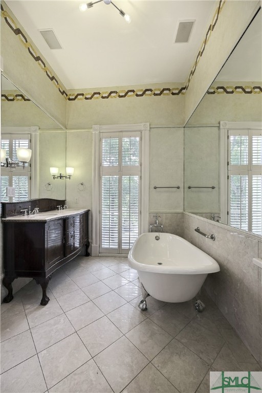 612 Barnard Street Savannah, GA 31401 - Photo 44 of 50 Modern clawfoot tub and vintage vanity in Primary Suite