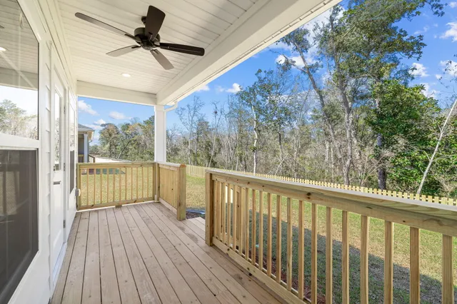 a view of a balcony with wooden floor