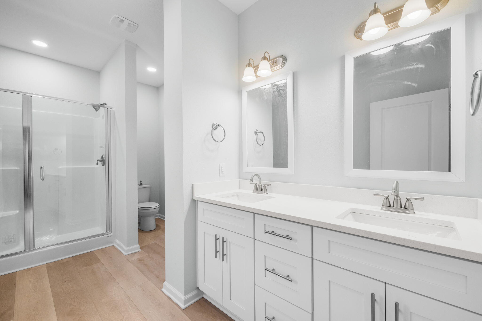 72 Riverwalk Circle Freeport, FL 32439 - Photo 14 of 34 a bathroom with a double vanity sink mirror and shower