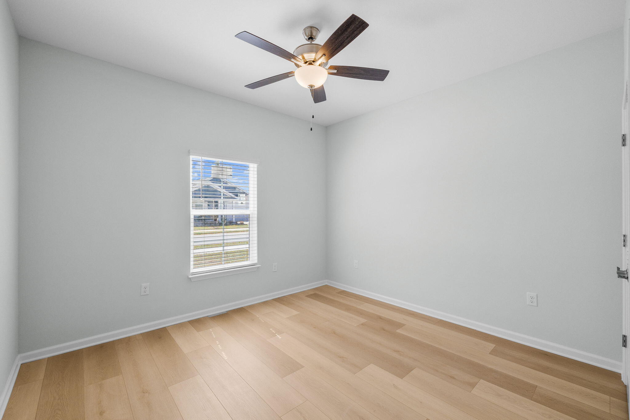 72 Riverwalk Circle Freeport, FL 32439 - Photo 17 of 34 an empty room with a window and a fan