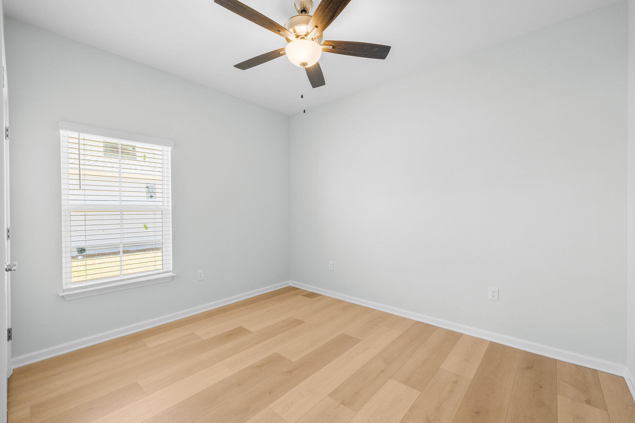 72 Riverwalk Circle Freeport, FL 32439 - Photo 18 of 34 an empty room with a window and a fan
