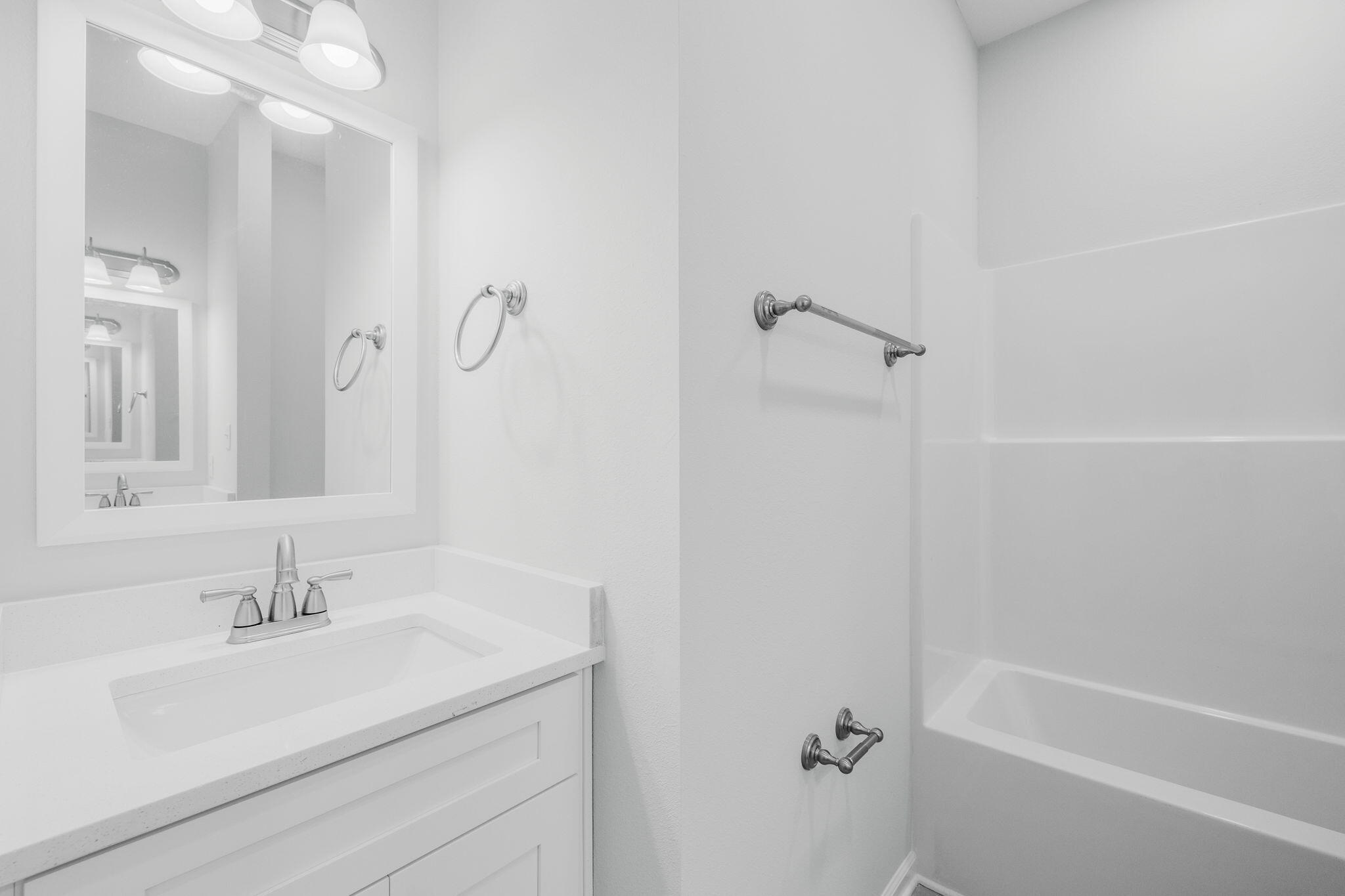 72 Riverwalk Circle Freeport, FL 32439 - Photo 21 of 34 a bathroom with a sink a toilet and shower