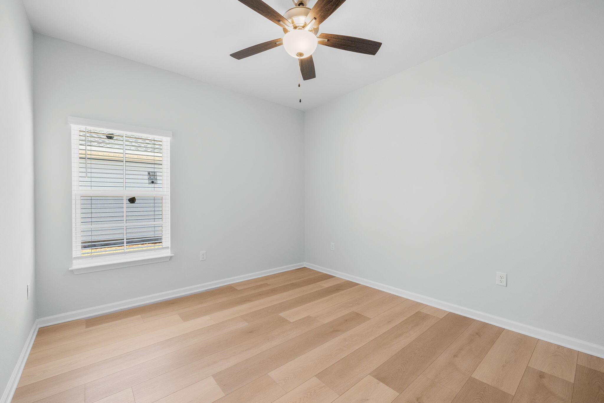 72 Riverwalk Circle Freeport, FL 32439 - Photo 22 of 34 an empty room with a window and a fan