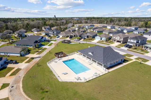an aerial view of a house with a ocean view