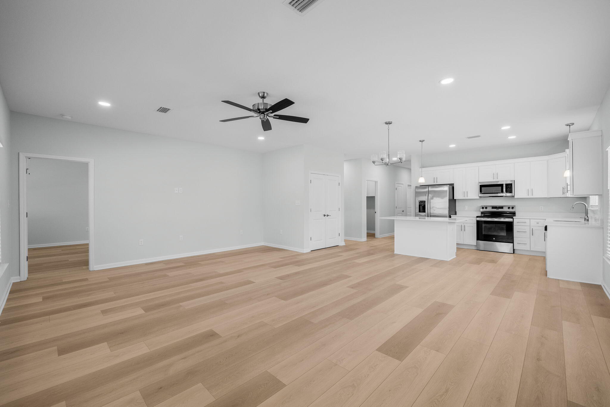 72 Riverwalk Circle Freeport, FL 32439 - Photo 9 of 34 a view of a kitchen with a sink and a stove