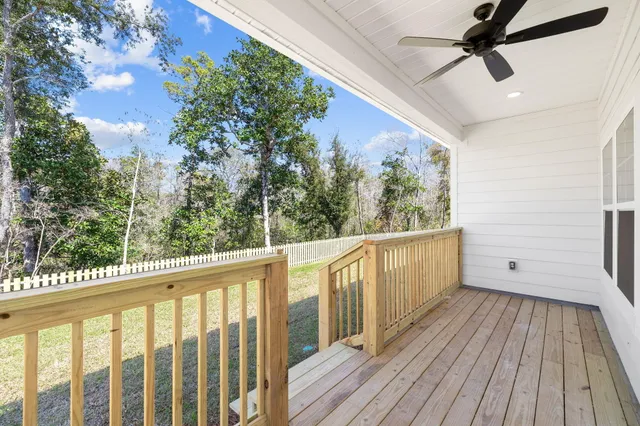 a view of a balcony with wooden floor