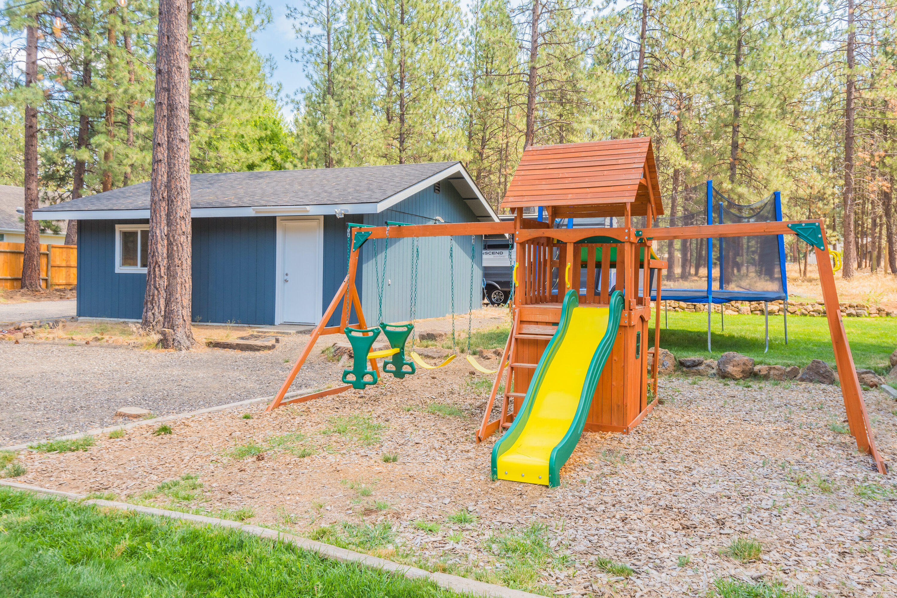 18749 Choctaw Road Bend, OR 97702 - Photo 18 of 22 a view of a backyard with a slide