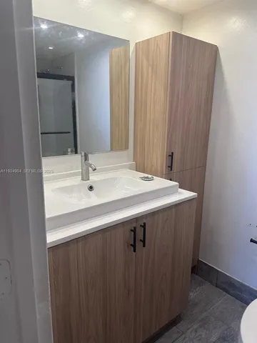 a sink with a mirror