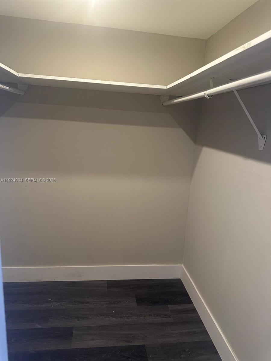 6770 Indian Creek Drive, Unit 6C Miami Beach, FL 33141 - Photo 16 of 19 a view of a room with wooden floor