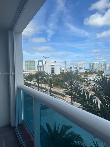 a view of a balcony with city
