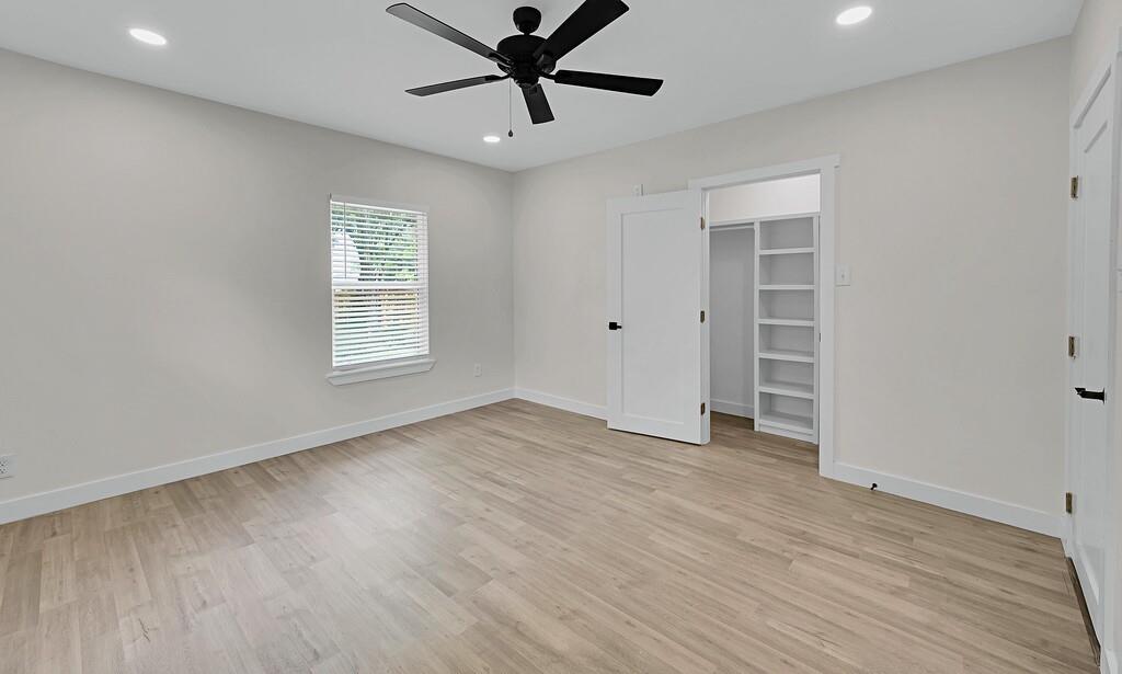 1713 Reuter Avenue Waco, TX 76708 - Photo 14 of 34 Unfurnished bedroom with light wood finished floors, baseboards, and recessed lighting