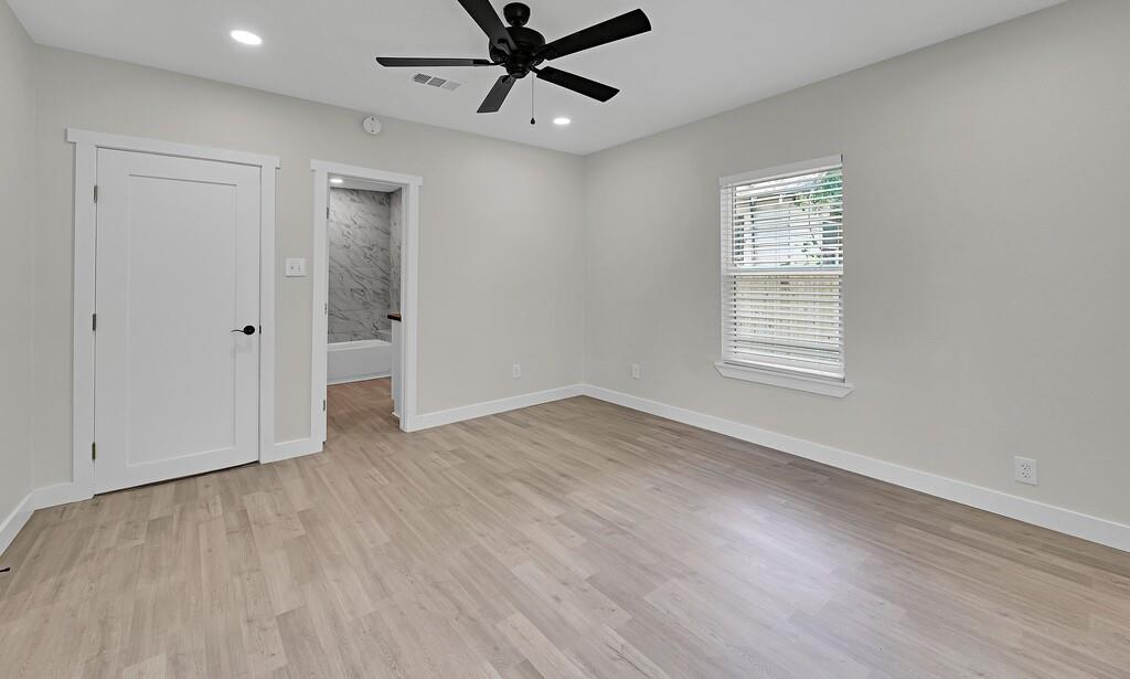 1713 Reuter Avenue Waco, TX 76708 - Photo 15 of 34 Unfurnished bedroom with baseboards, light wood-type flooring, recessed lighting, a ceiling fan, and ensuite bathroom