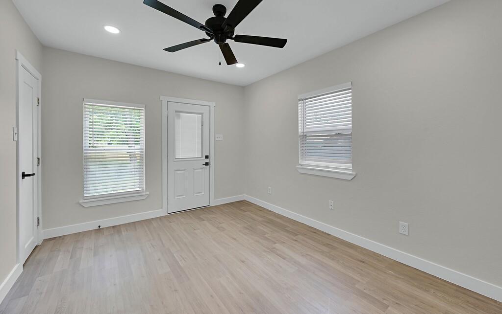 1713 Reuter Avenue Waco, TX 76708 - Photo 25 of 34 Empty room with baseboards, light wood-style floors, ceiling fan, and recessed lighting