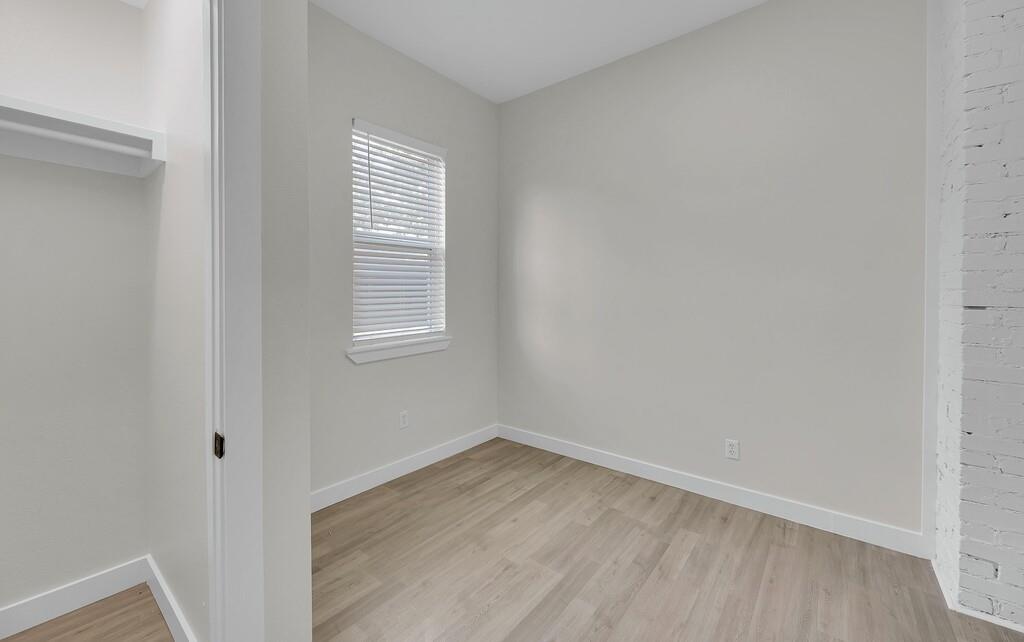 1713 Reuter Avenue Waco, TX 76708 - Photo 27 of 34 Unfurnished bedroom featuring light wood-style flooring and baseboards