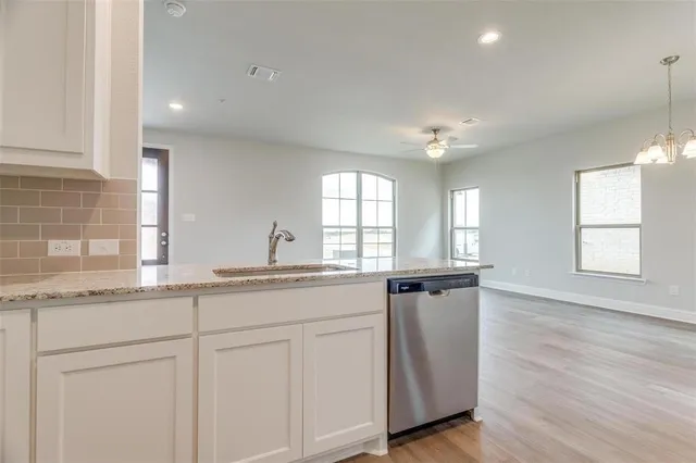 a kitchen with granite countertop white cabinets and a granite counter tops