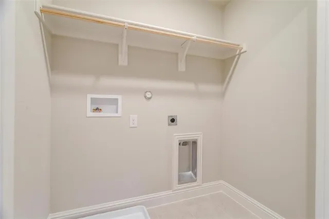 a view of a yard with wooden fence