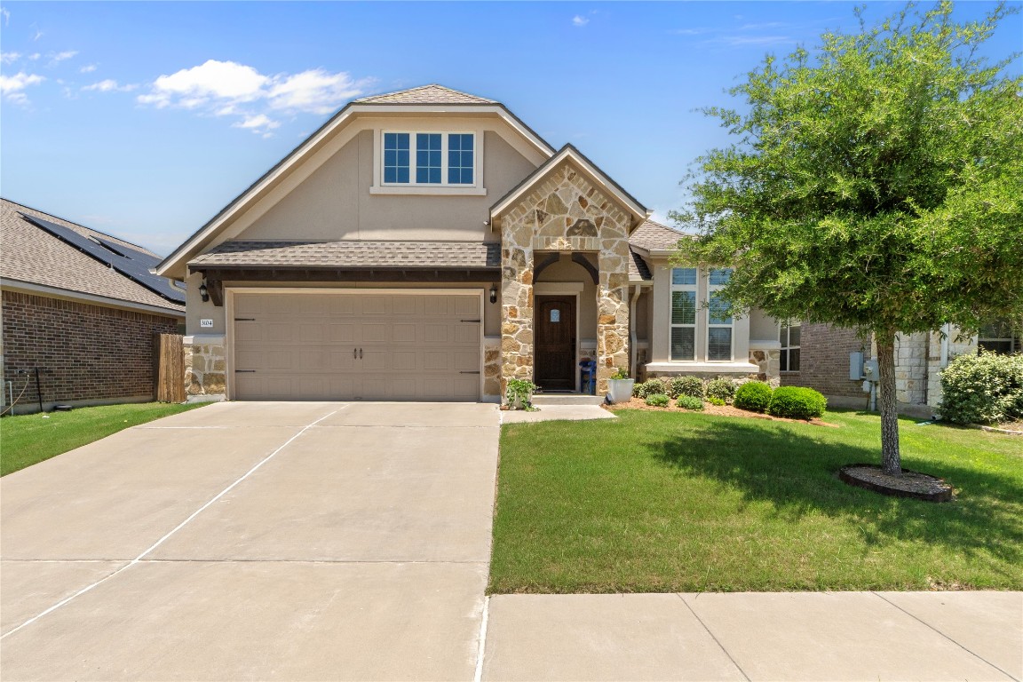 3104 Bragg Place Pflugerville, TX 78660 - Photo 1 of 1 a front view of a house with a yard